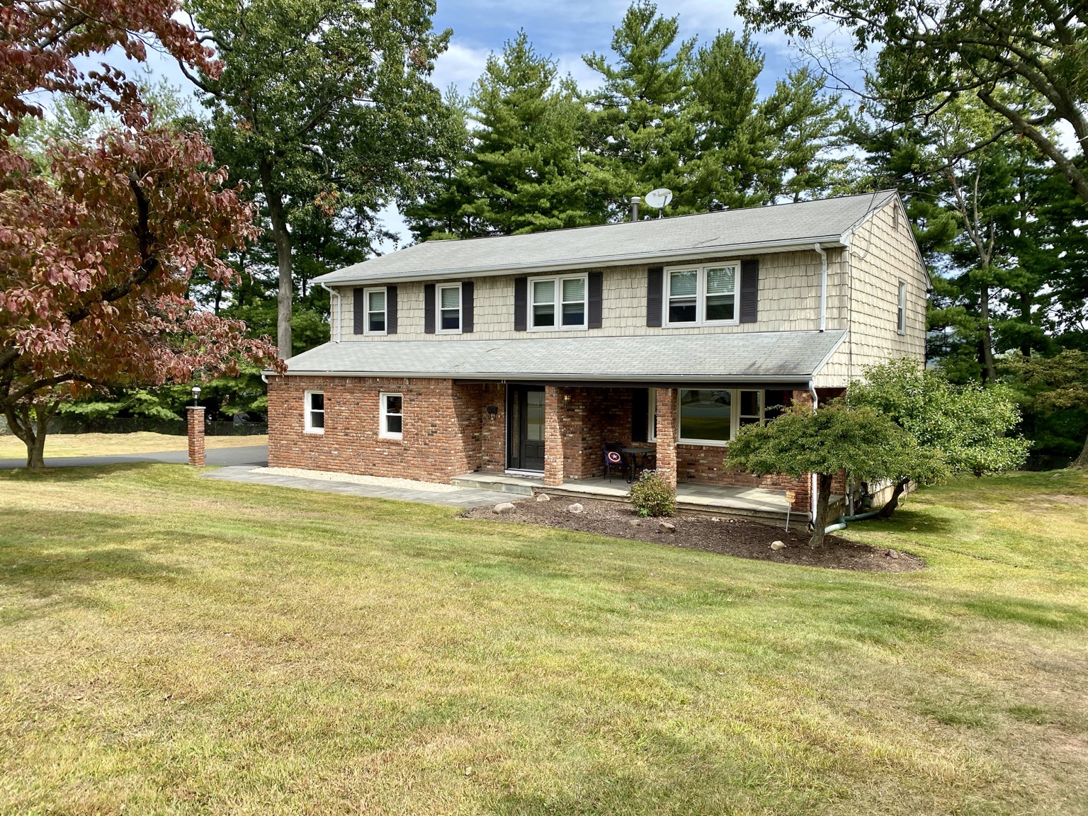Two-story home with a brick lower level in Tappan